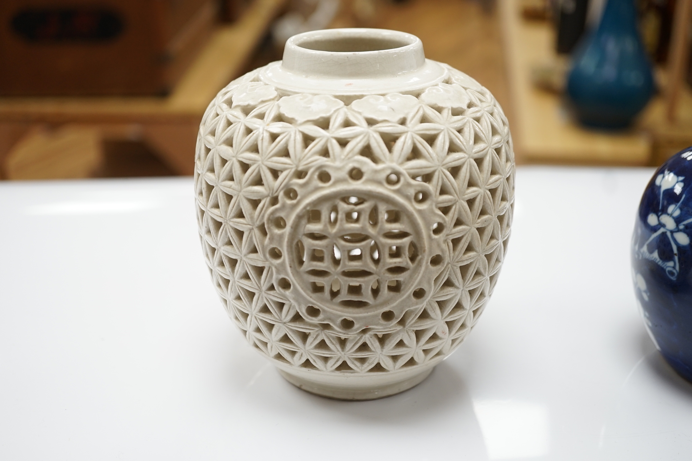 A 19th century Chinese blue and white jug, a similar jar and a pierced jar, tallest 15cm